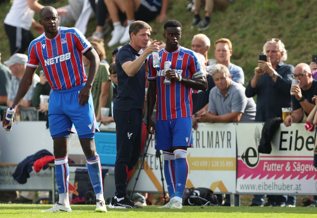 Oliver Glasner speaks to Marc Guehi during a friendly between Crystal Palace and Augsburg