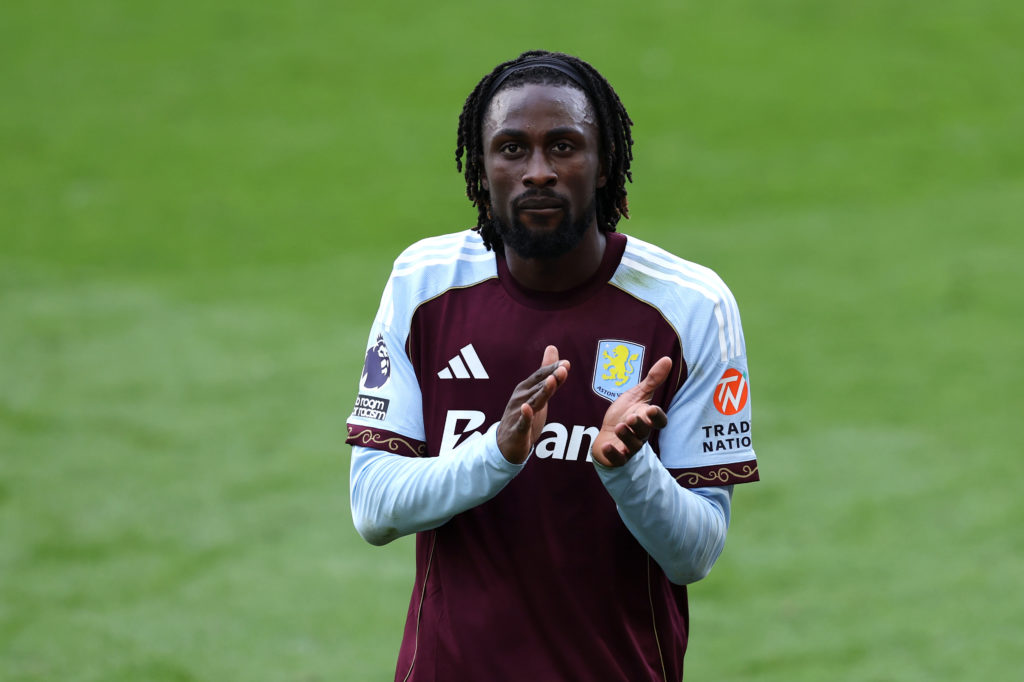 Evann Guessand of Aston Villa applauds the fans.