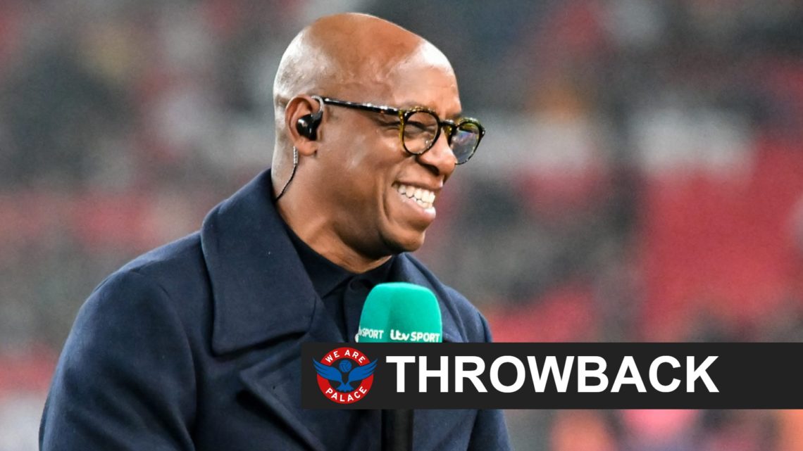 Pundit Ian Wright holds the mic.