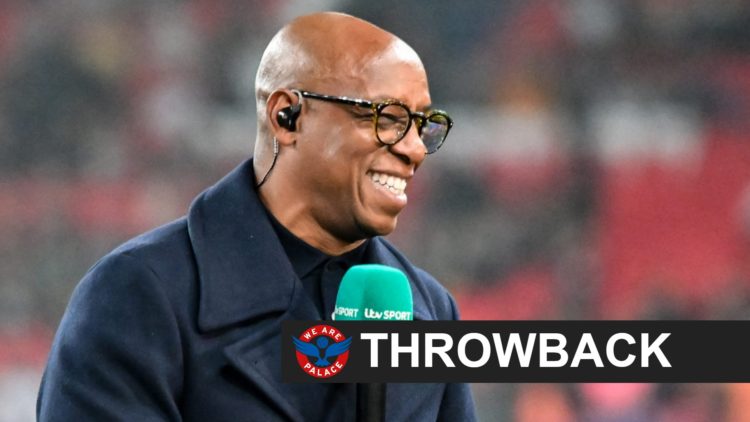Pundit Ian Wright holds the mic.