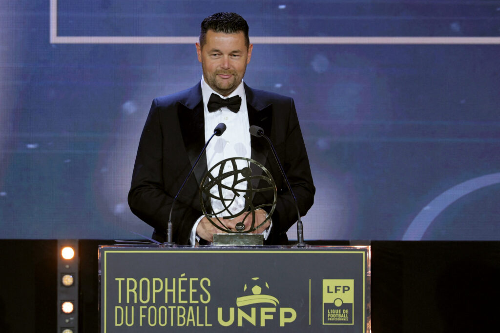 Pierre Sage accepting an award